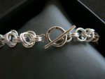 Hand made sterling bracelet with ring n bar clasp. Click for more information...