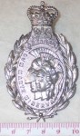 Large white metal QC Canadian Artists 21 SAS reg badge. Click for more information...