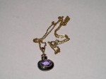 9ct Gold Amethyst Pendant with plated chain. Click for more information...