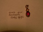 Gold Pendant with synth Ruby. Click for more information...