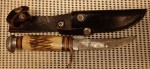 Old vintage Bowie style sheath knife. Click for more information...